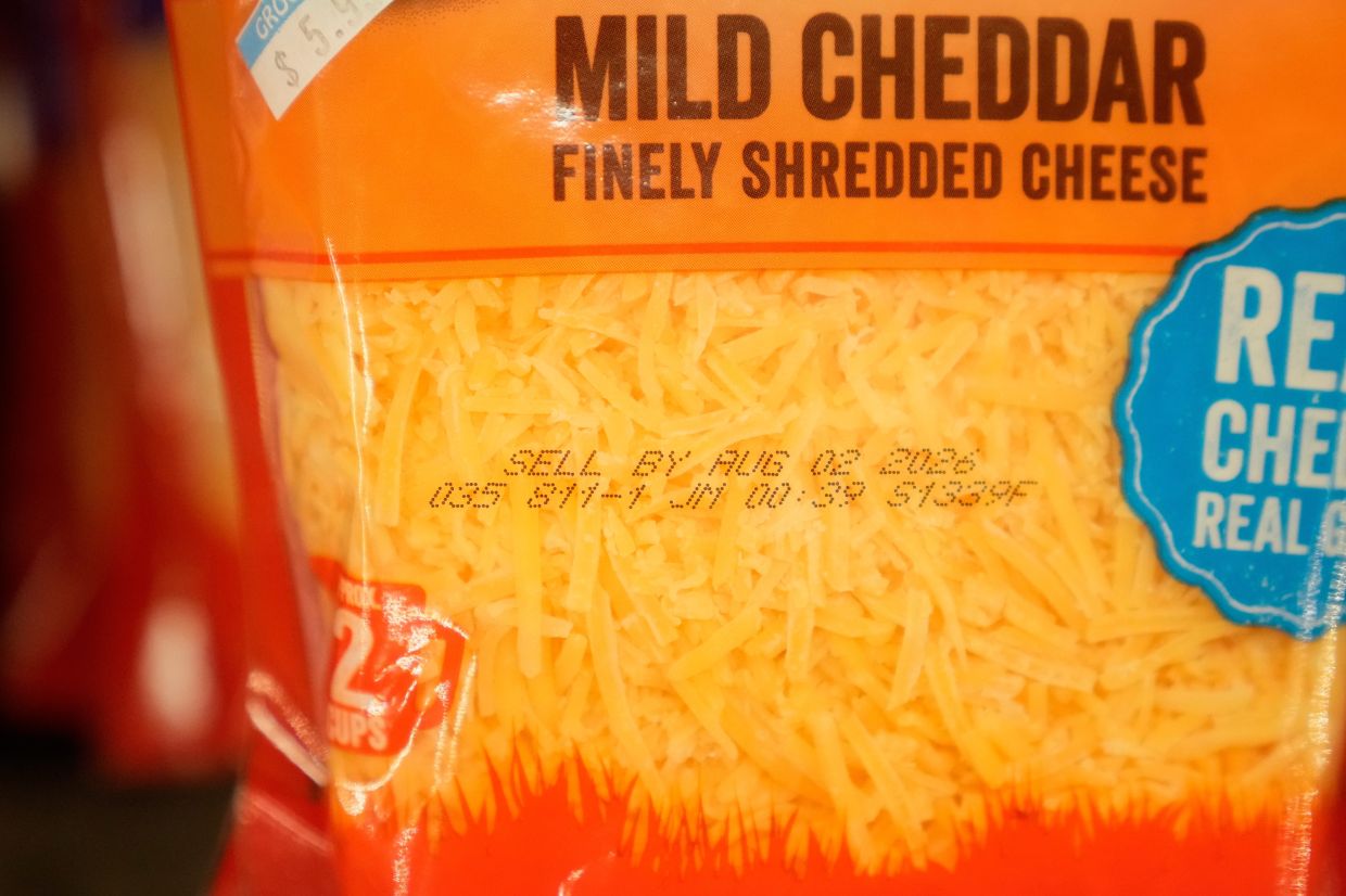 A Sell By date is stamped on package of cheese displayed at Park Plaza Fine Foods in San Francisco.