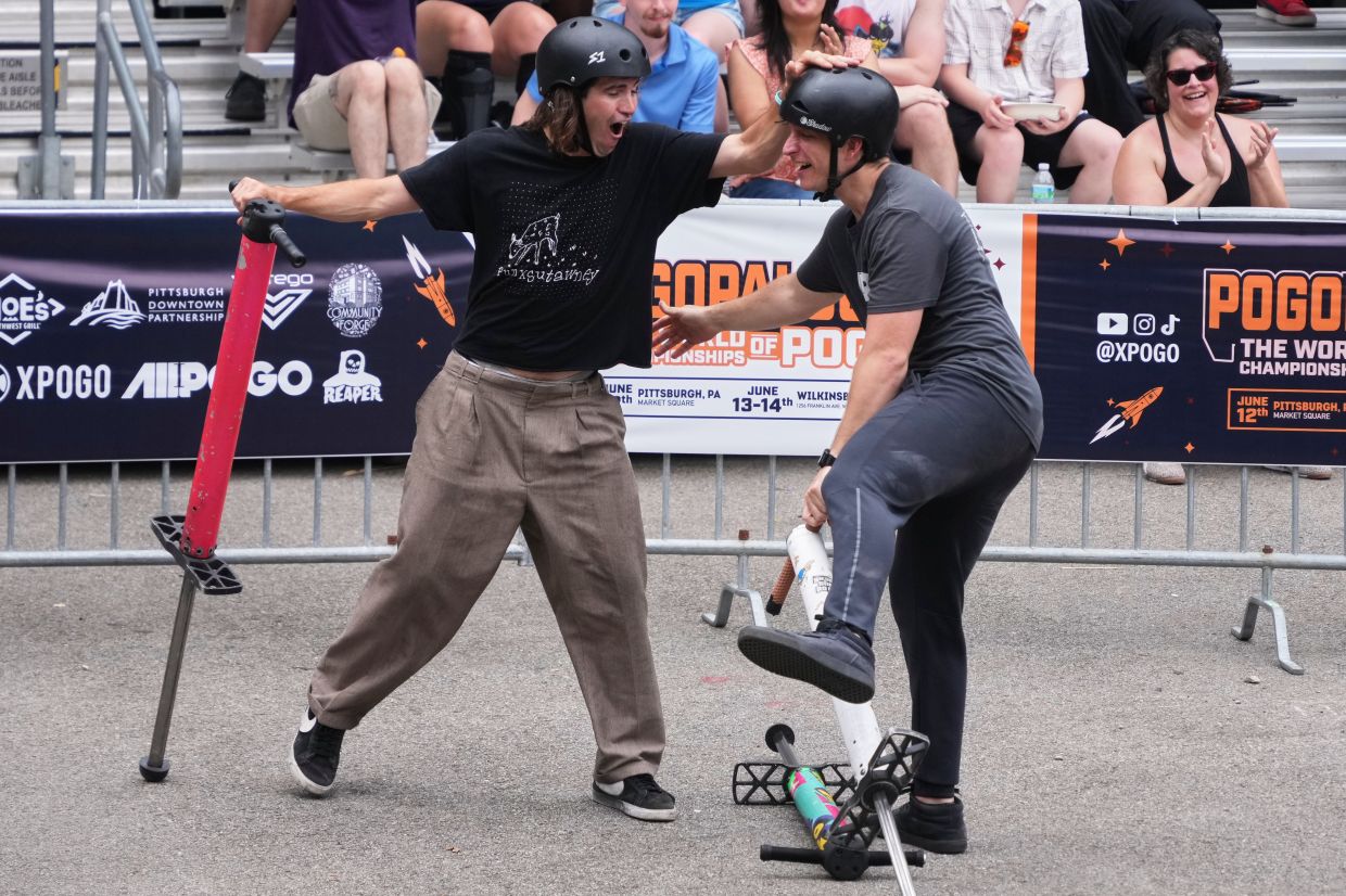 Pogo athlete Michael Mena (right) celebrates with Henry Cabelus after his award winning trick during the Best Trick competition of Pogopalooza 2026.