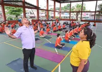 Young and old gather to mark International Yoga Day in George Town