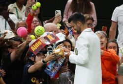 Tennis-Djoker Djokovic scares ball girl, then eyes McIlroy's Green Jacket