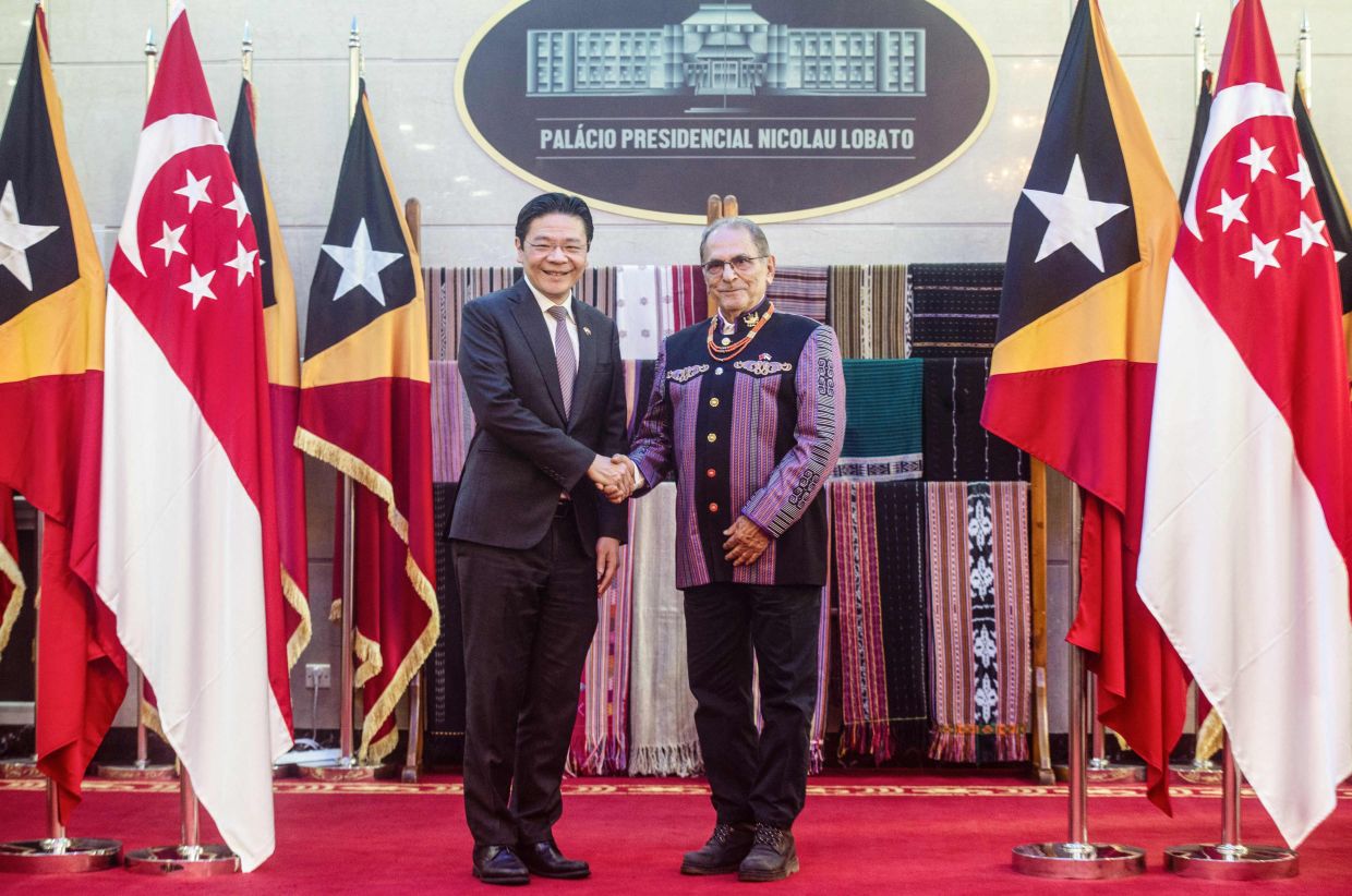 Singaporean Prime Minister Lawrence Wong (left) and East Timor's President Jose Ramos-Horta shake hands at the Nicolau Lobato Presidential Palace in Dili on Friday, July 3, 2026. -- Photo by Valentino Dariell DE SOUSA / AFP