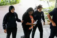 Ex-kindie teacher claims trial to money laundering involving RM133,550