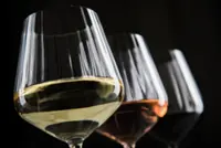 What is 'house wine' and what are the pros and cons of ordering it?