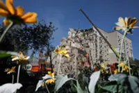 Rescuers scour rubble as Kyiv mourns deadliest Russian attack this year