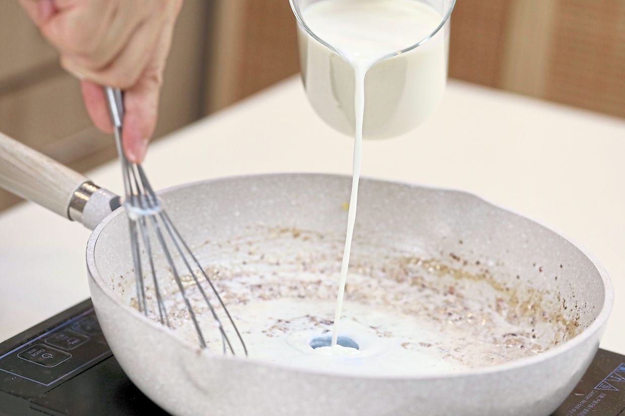 Drizzle milk into the roux, whisking continuouslyinto a silky smooth gravy, then season.