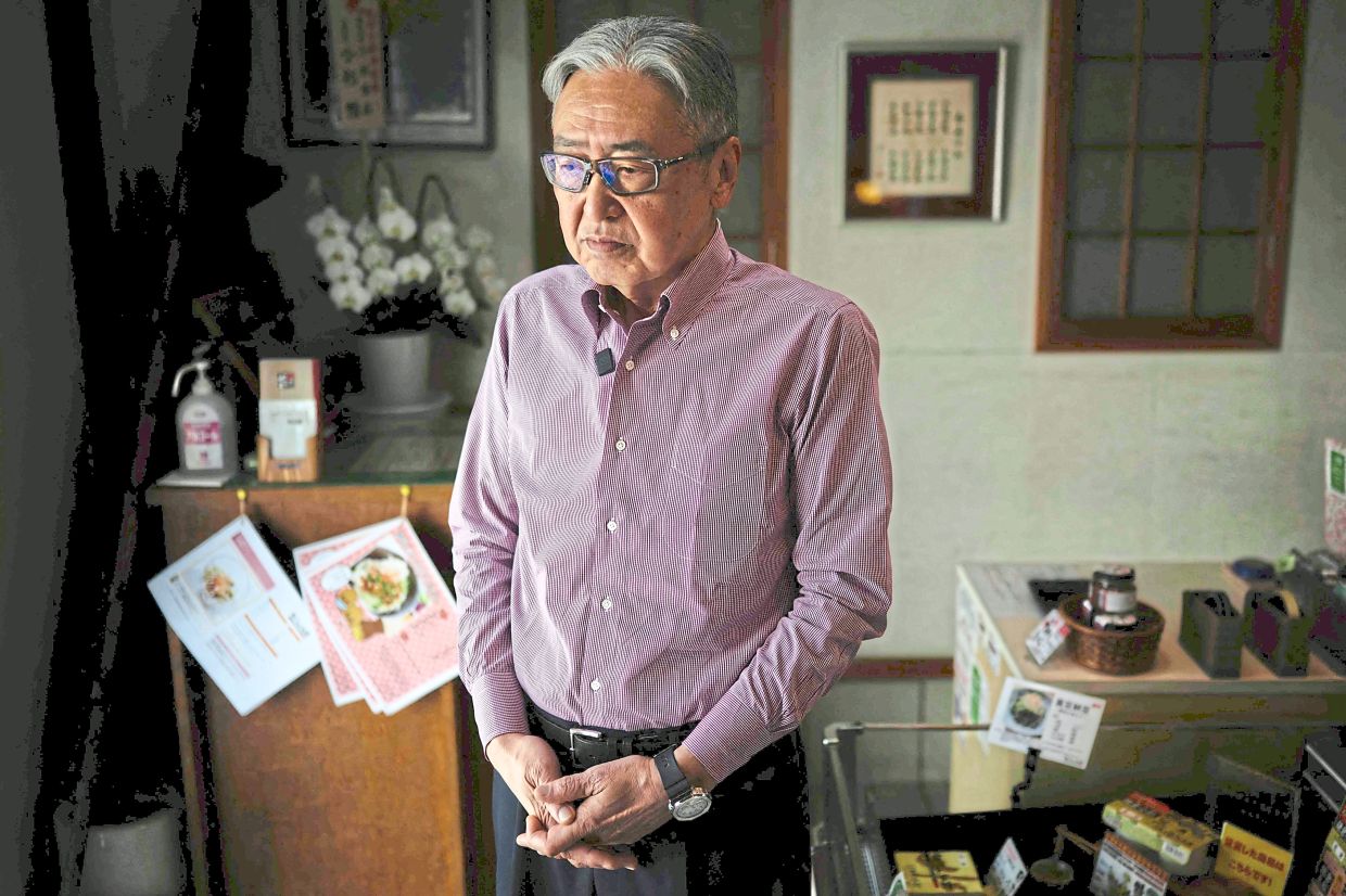 Bean maker: Noro posing for a photo at his store in Kamakura.