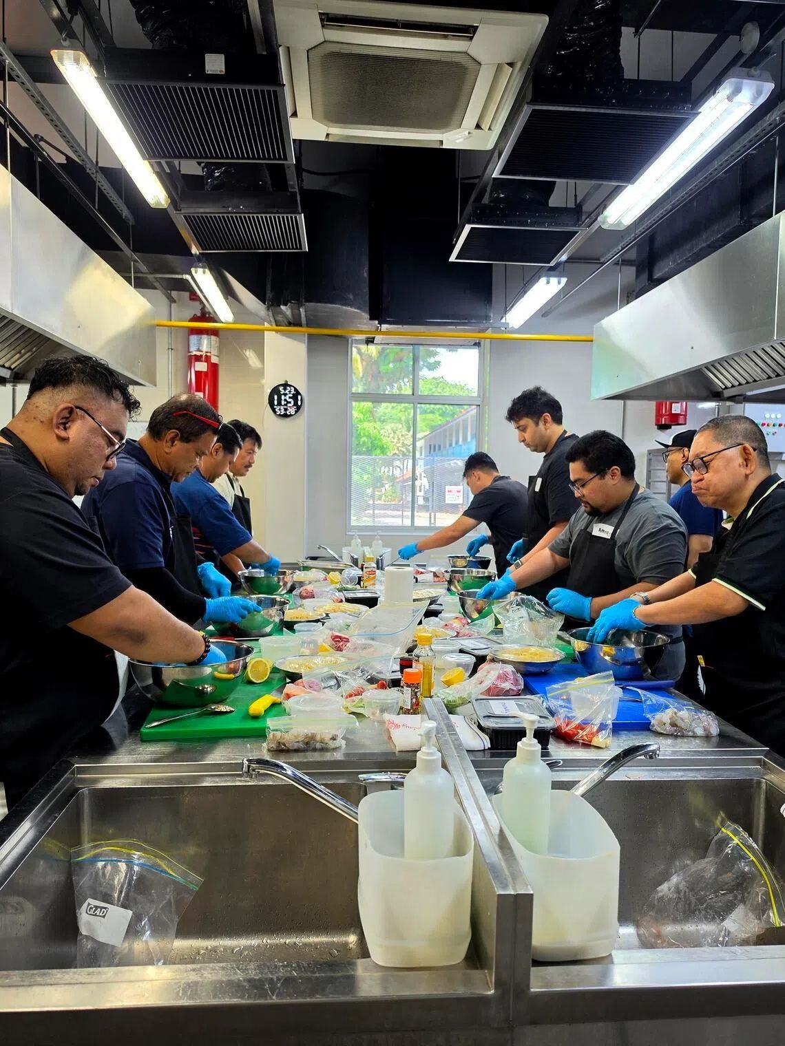 At the cooking session organised by Fellowship of Men Singapore, participants cooked a surprise meal for their loved ones. - Photo: FELLOWSHIP OF MEN SINGAPORE