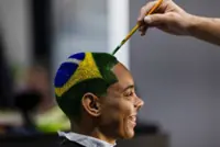 Barber shaves World Cup dreams into Brazilian fans' hair