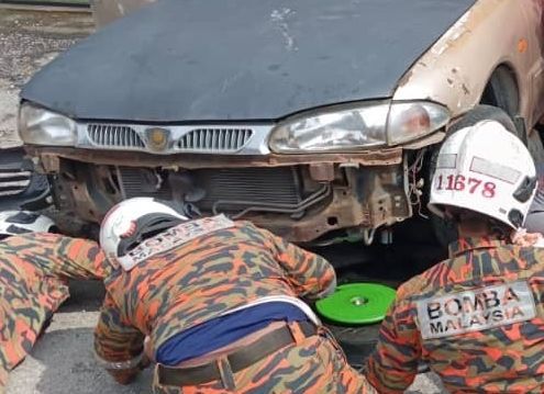 Woman pinned under car after vehicle, with engine left running, rolls forward