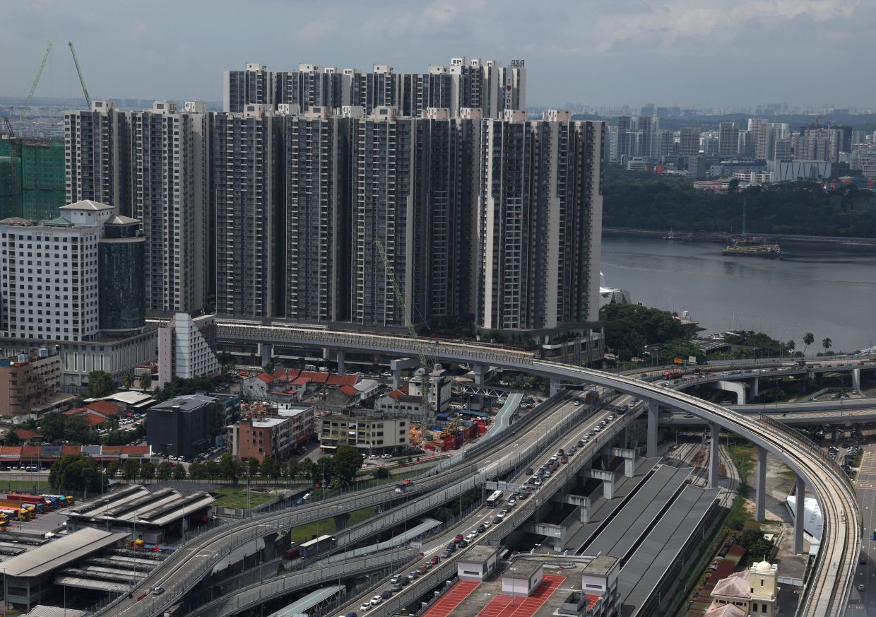 A view of the tracks of the Johor Bahru-Singapore Rapid Transit System (RTS) Link running past residential apartments in Johor Bahru, Malaysia, on Monday, July 6, 2026. Photo: REUTERS/Edgar Su