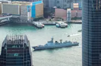 Residents, visitors flock to waterfront as PLA Navy ships sail into Hong Kong