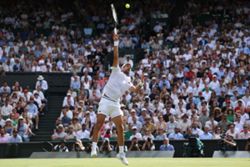 Tennis-Djokovic moves past another Federer milestone to make Wimbledon quarter-finals