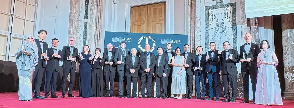 Campagnoli (centre) and Yu (to his left) with World Silver Winners at the FIABCI event in Vienna.