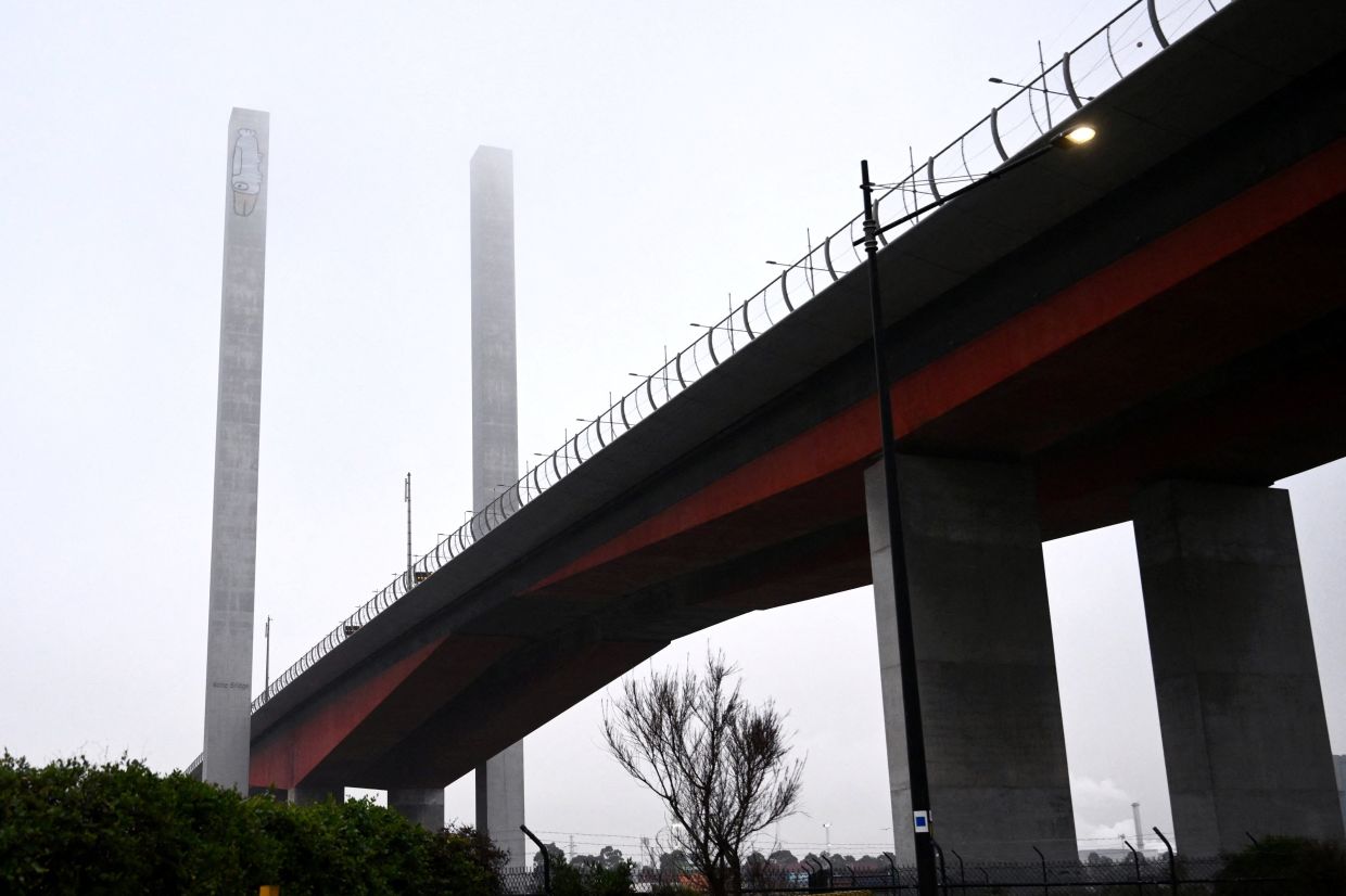 A graffiti tag often associated with ‘Pam the Bird’ on the eastern pylon of the Bolte Bridge in Melbourne. - Reuters
