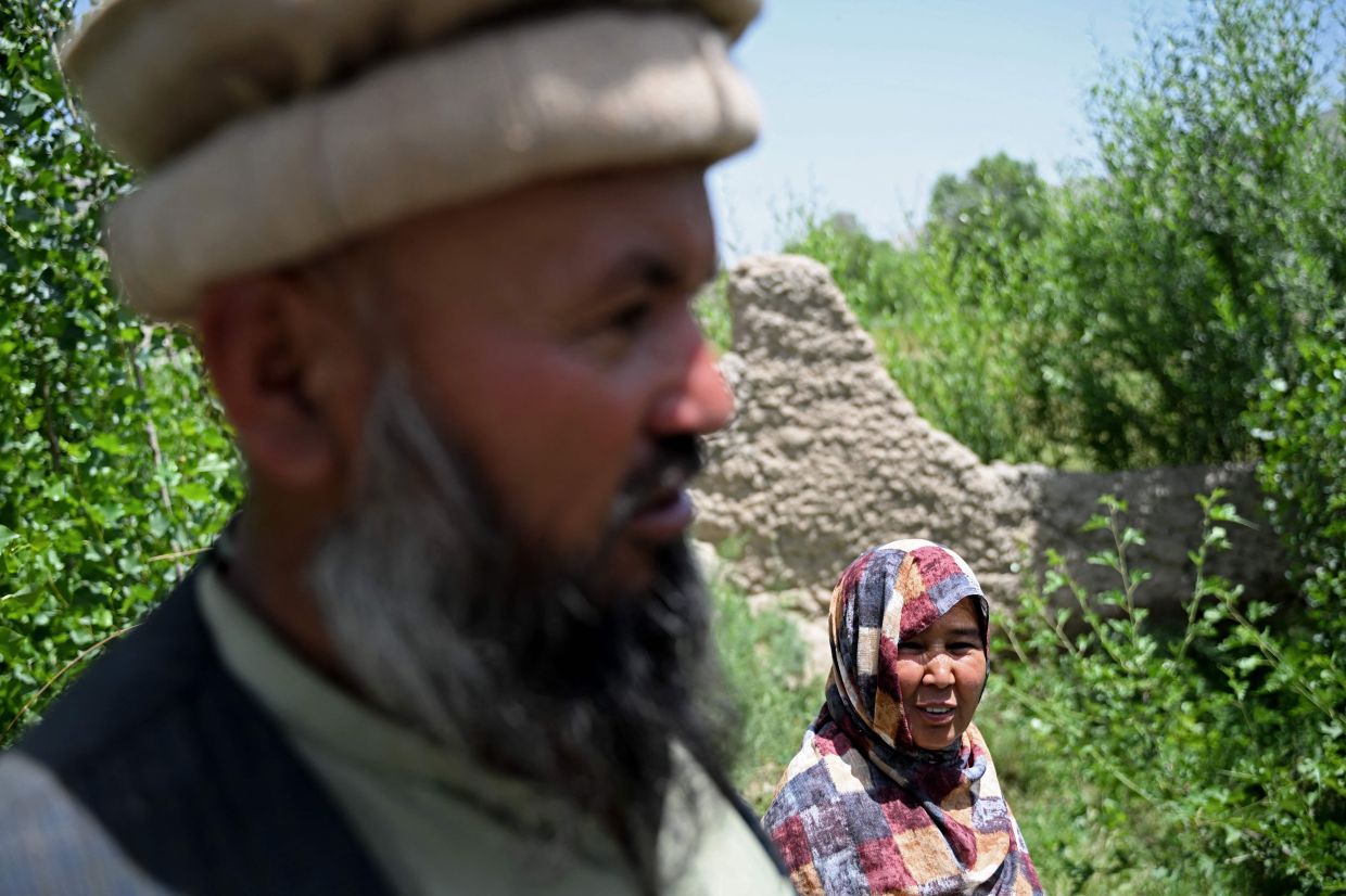 Bas Begum (right) standing next to her husband Abdul Samad Ahmadi at her family-owned plot, which supports a micro-forest.