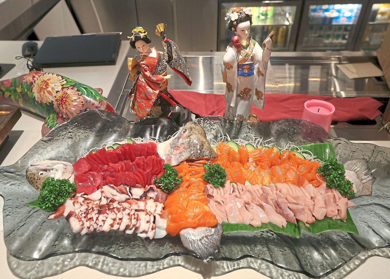 Fresh sashimi of octopus, tuna, salmon and longfin yellowtail and seafood pasta (below) making the cut at Ita-Yo Sunday Brunch.