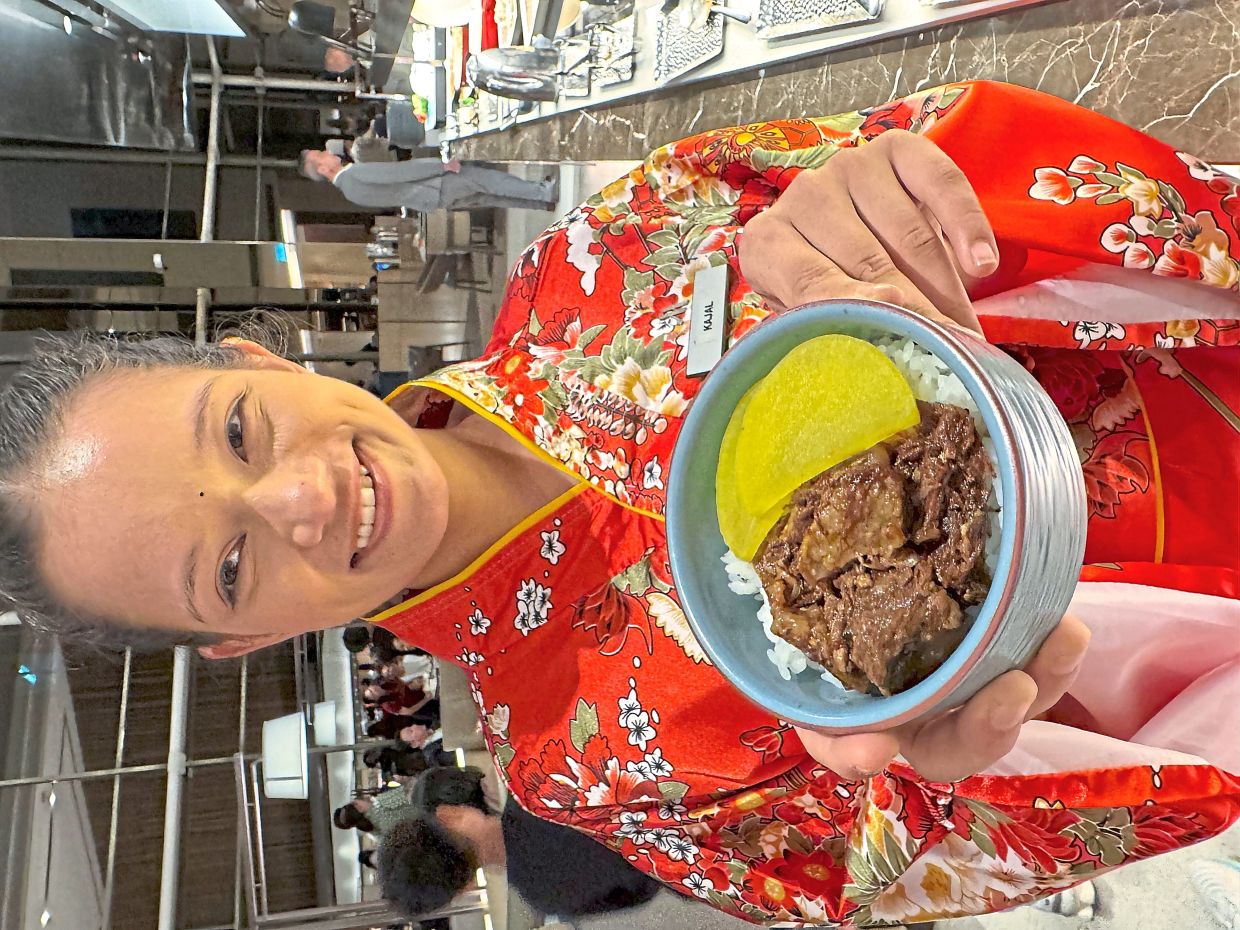 Kimono-clad server with Mini Wagyu Donburi.