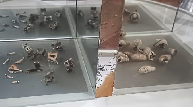 Display on history of archaeological digs in the millennia-old site alongside finds such as animal bones and diorama on the life of Neolithic folk (below).