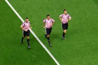 Soccer-The World Cup's hidden runners: referees keep pace with players and pressure