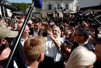 Cheers and boos for Le Pen's French campaign launch after guilty verdict