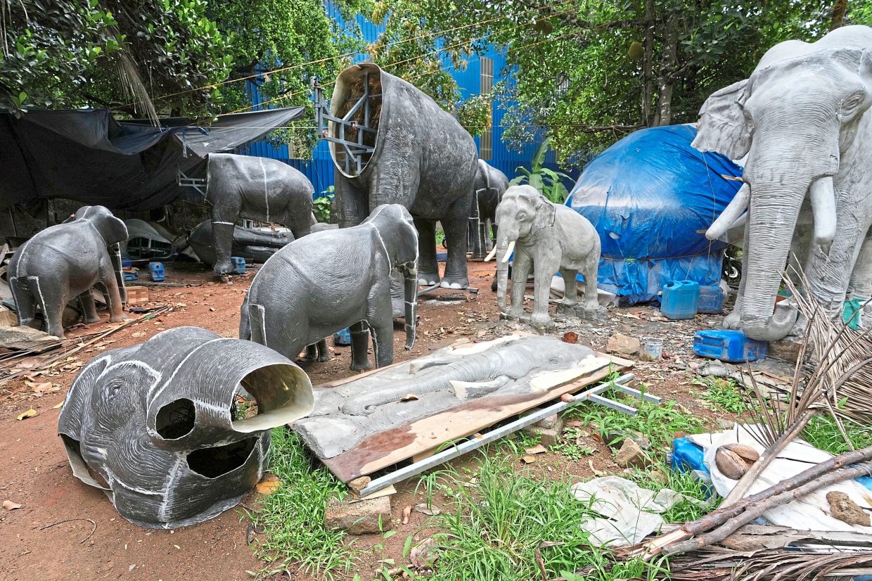 Unfinished robotic elephants lying in a backyard workshop in Chalakudy. — AP