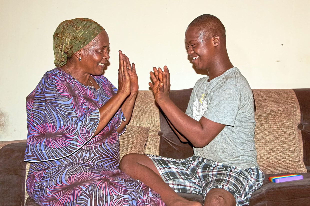 Diallo's dream is to see her son Kazaliou read and write.
