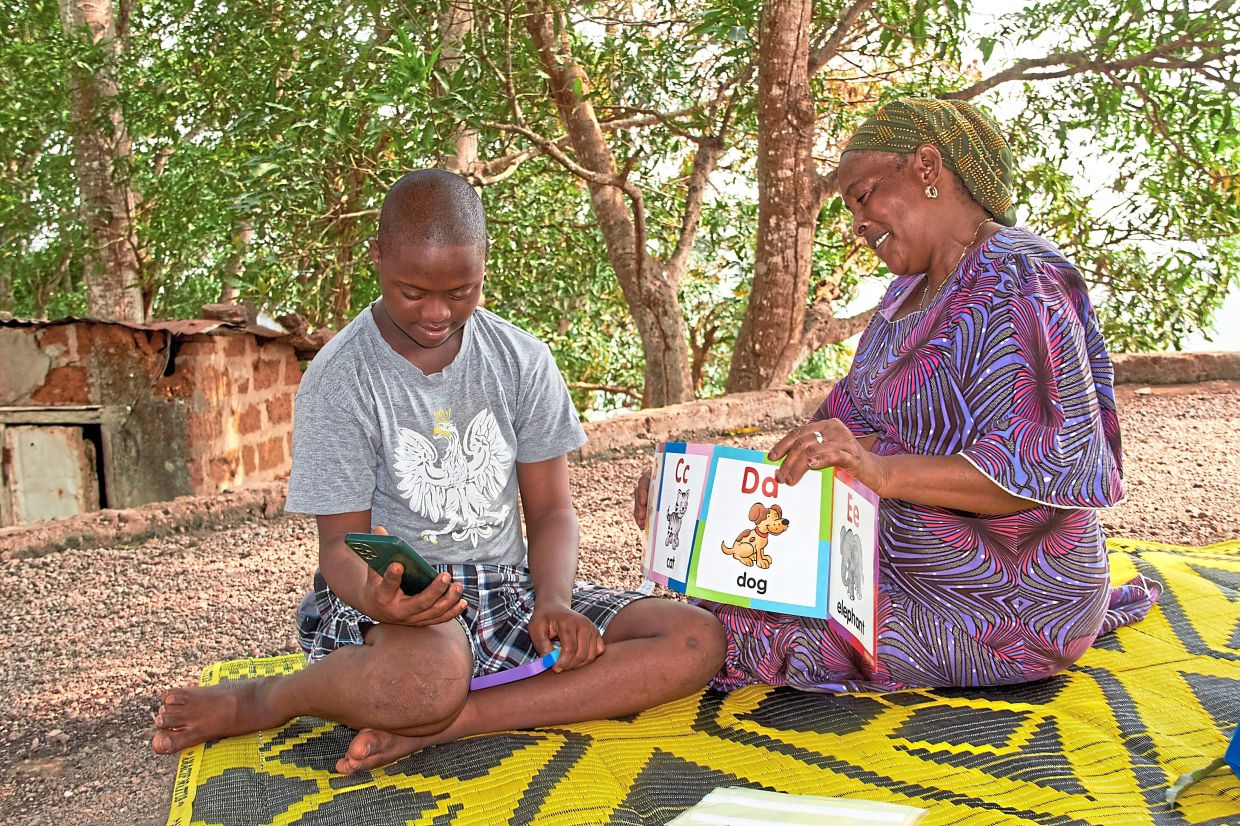 Diallo spends a lot of time teaching her autistic child.