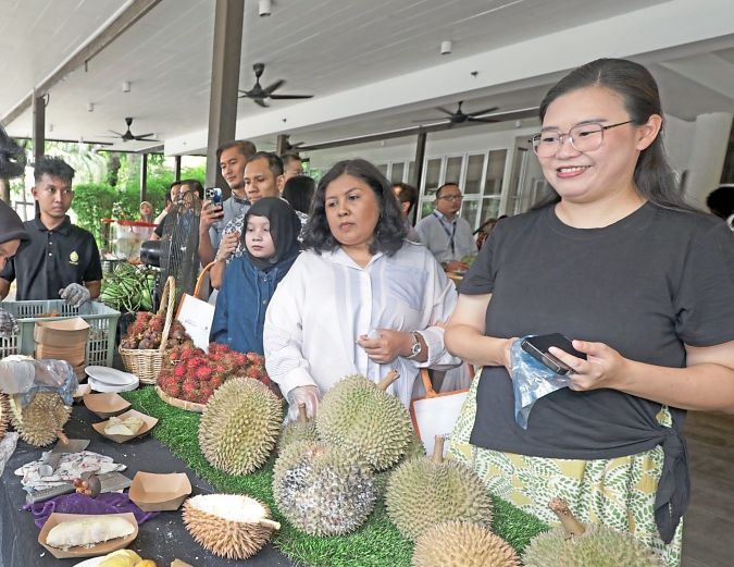 Guests sampling premium durian during the launch of Durian Hub 2026 at Palm Garden Hotel Putrajaya.