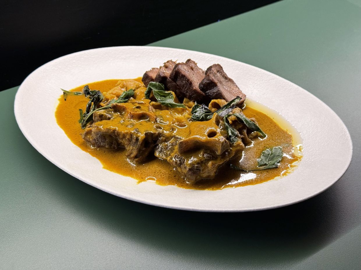 The beef gulai tiga sekawan features a rich, hearty gulai filled with beef tongue, oxtail and beef belly that has been cooked to a point of perfect pliancy. — Photo: MICHAEL CHEANG/The Star