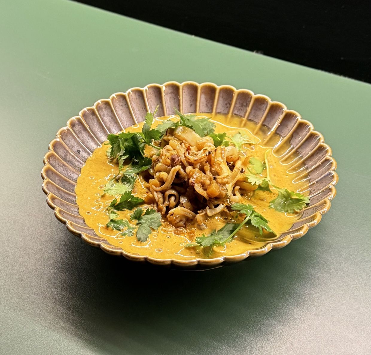Squid takes the place of noodles in this fun odyssey through aquatic territory. — Photo: MICHAEL CHEANG/The Star