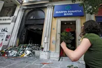 Greece arrests two over deadly 2010 protest fire-bombing