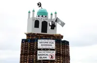 Replica of mosque set alight on Northern Ireland bonfire