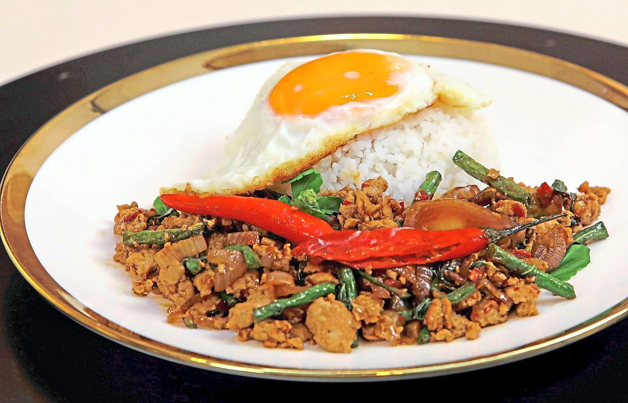 Minced chicken with holy basil or ‘pad kaprao’ is best savoured with white rice and a sunny side up egg.