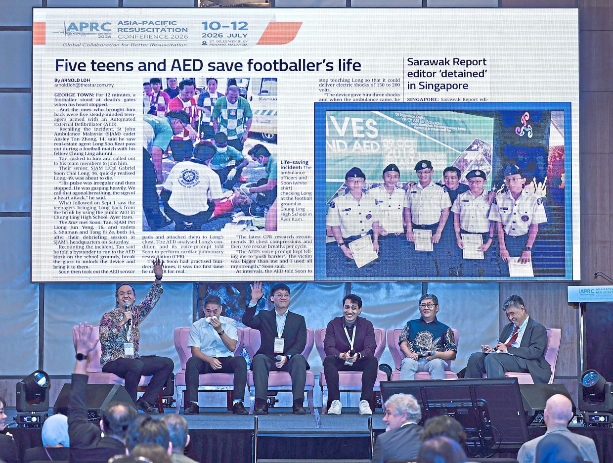 Young heroes: Long (second from left) tearing up during a panel at the Asia-Pacific Resuscitation Conference 2026. With him were (from left) Dr Goh, Soon, Shaman, Wong and Singapore Resuscitation and First Aid Council chairman Prof Lim Swee Han. — ZHAFARAN NASIB/The Star.