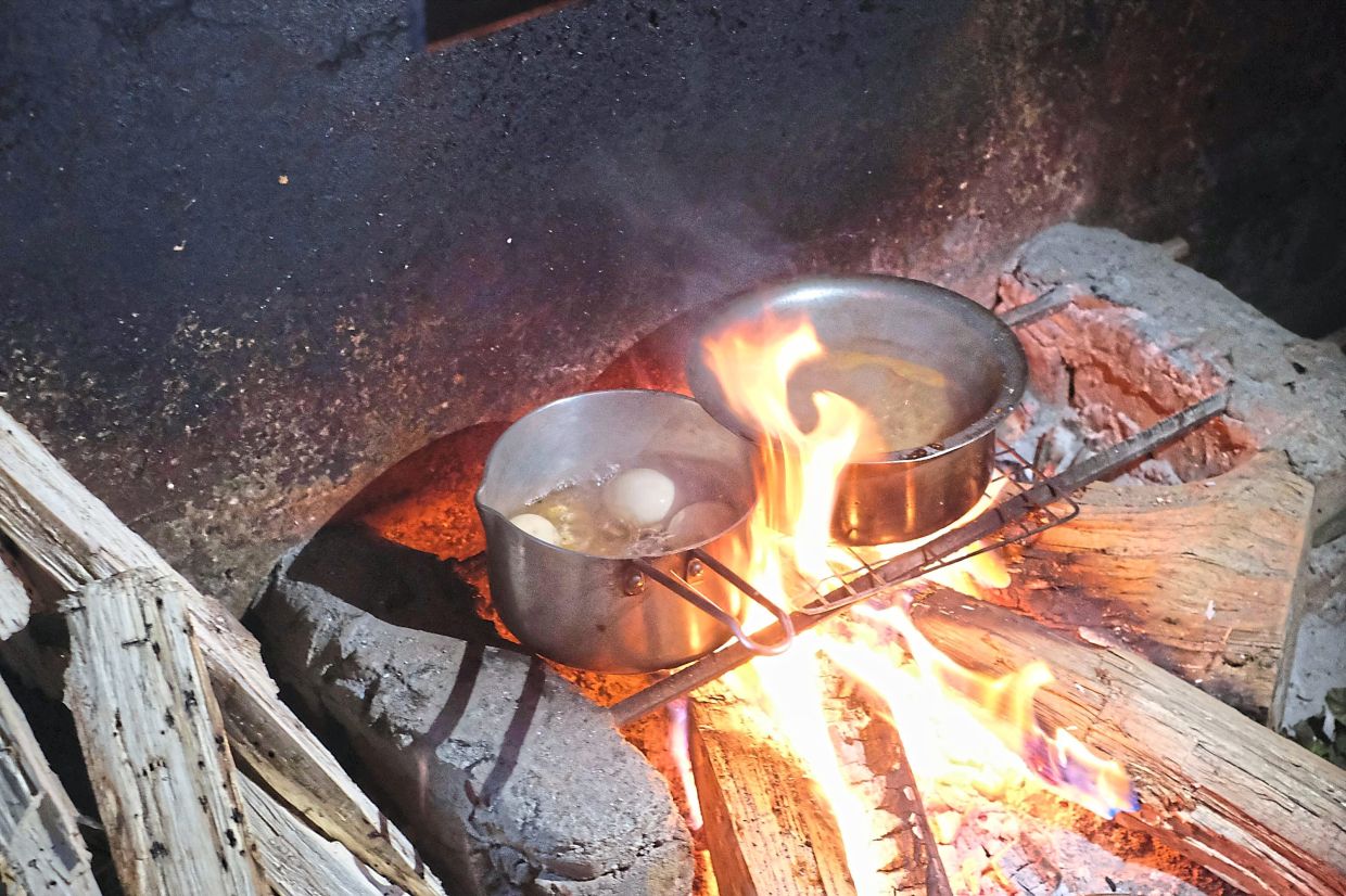 Eggs boil on a hearth in Kohima.