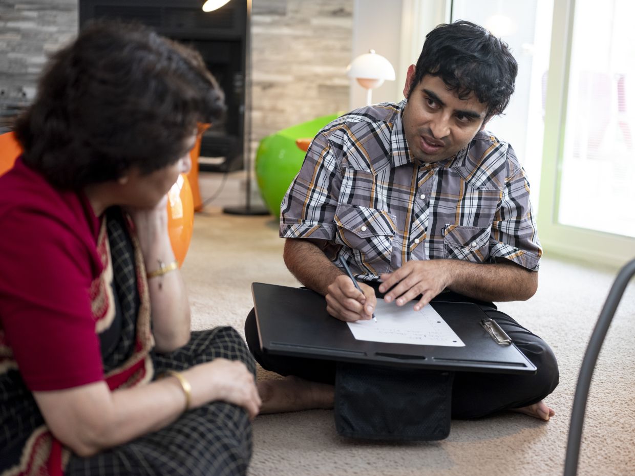 Tito Mukhopadhyay composes a poem at home in Austin.