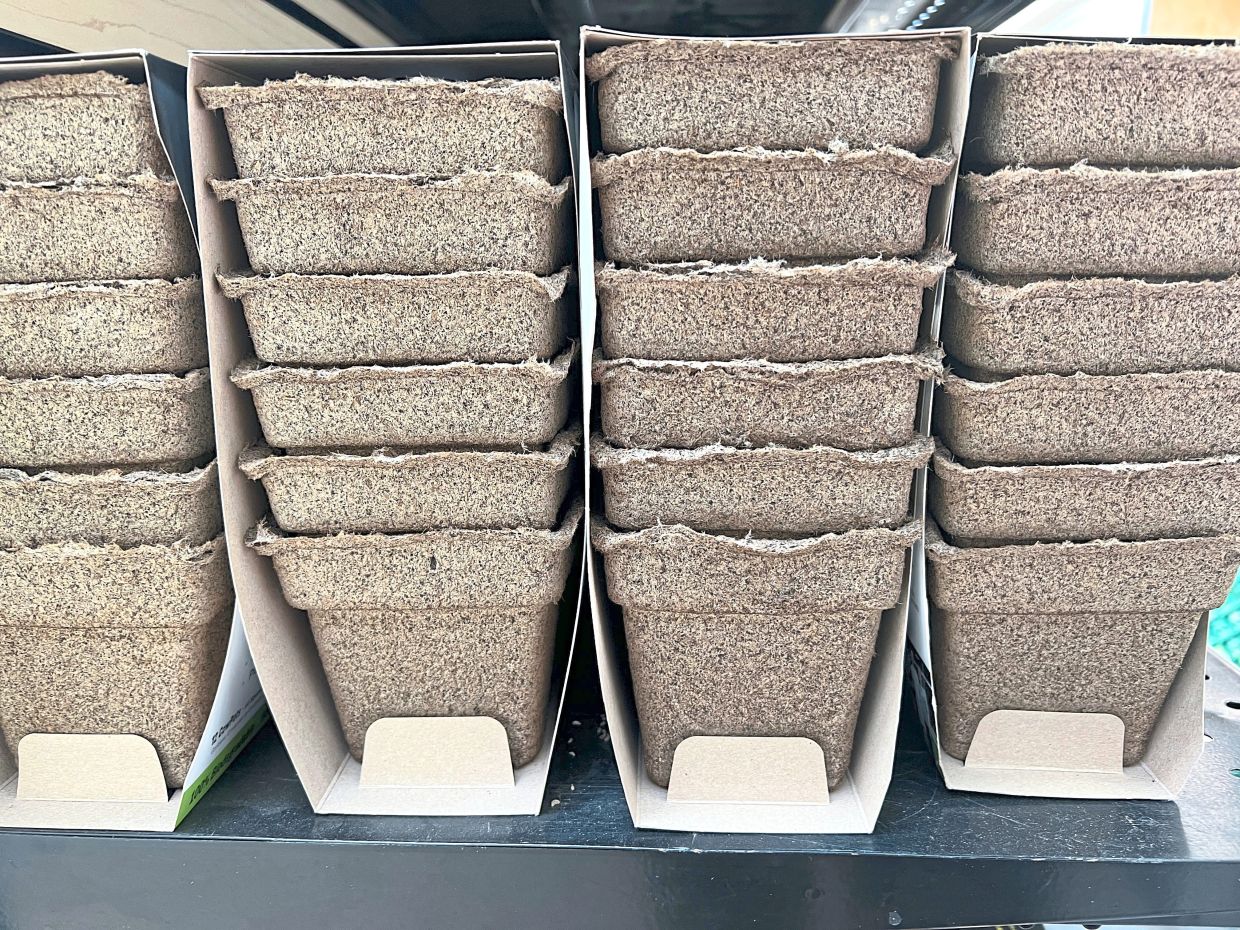 Packages of plastic-free, manure-based planting pots.