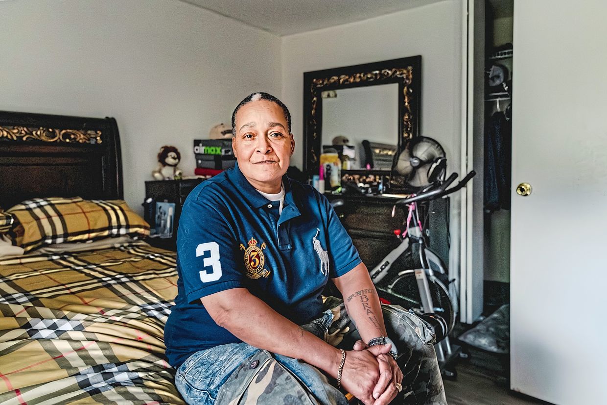 Santiago, whose cats were a comfort to her through domestic violence and homelessness, in New York.