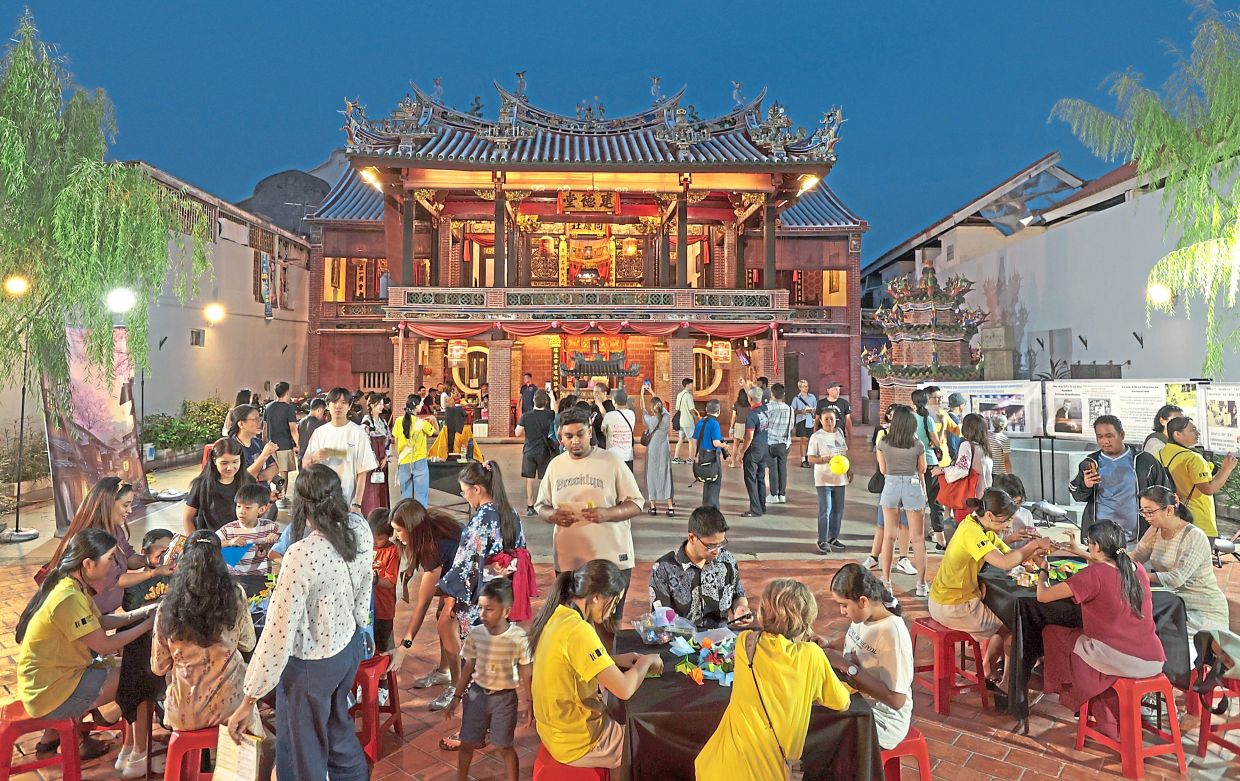 Visitors doing origami at Hock Teik Cheng Sin Temple.