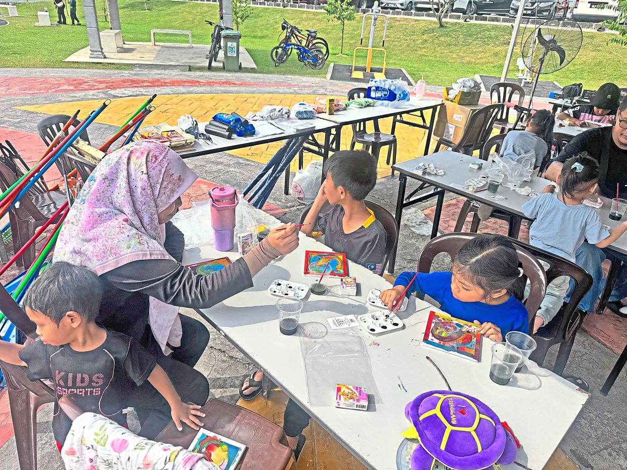 Children taking part in a colouring activity at the event.