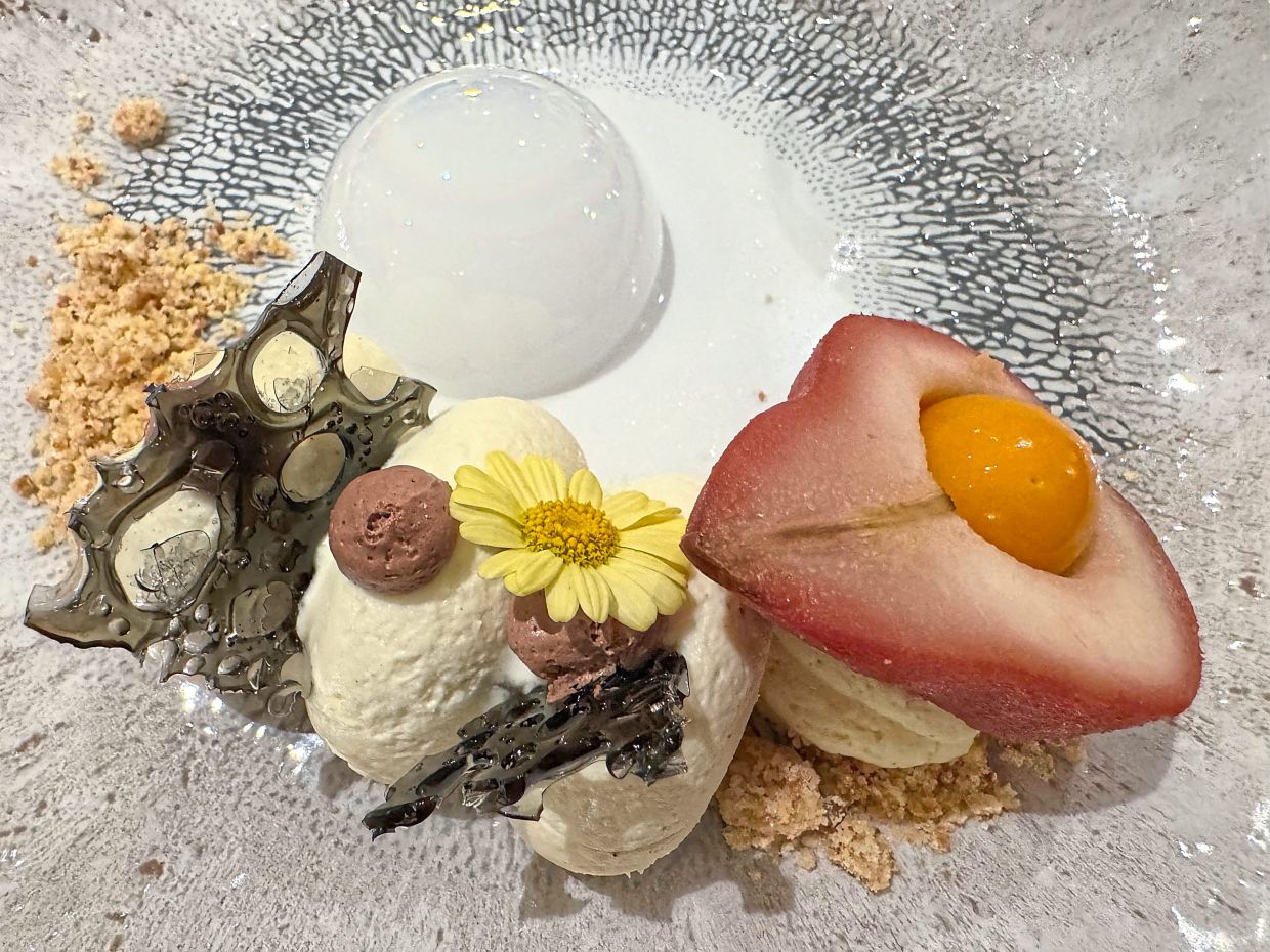 The ship pastry chef’s elevated take on a classic French poached pear dessert, poire belle-Helene.