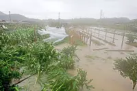 Typhoon Bavi weakens but leaves trail of damage
