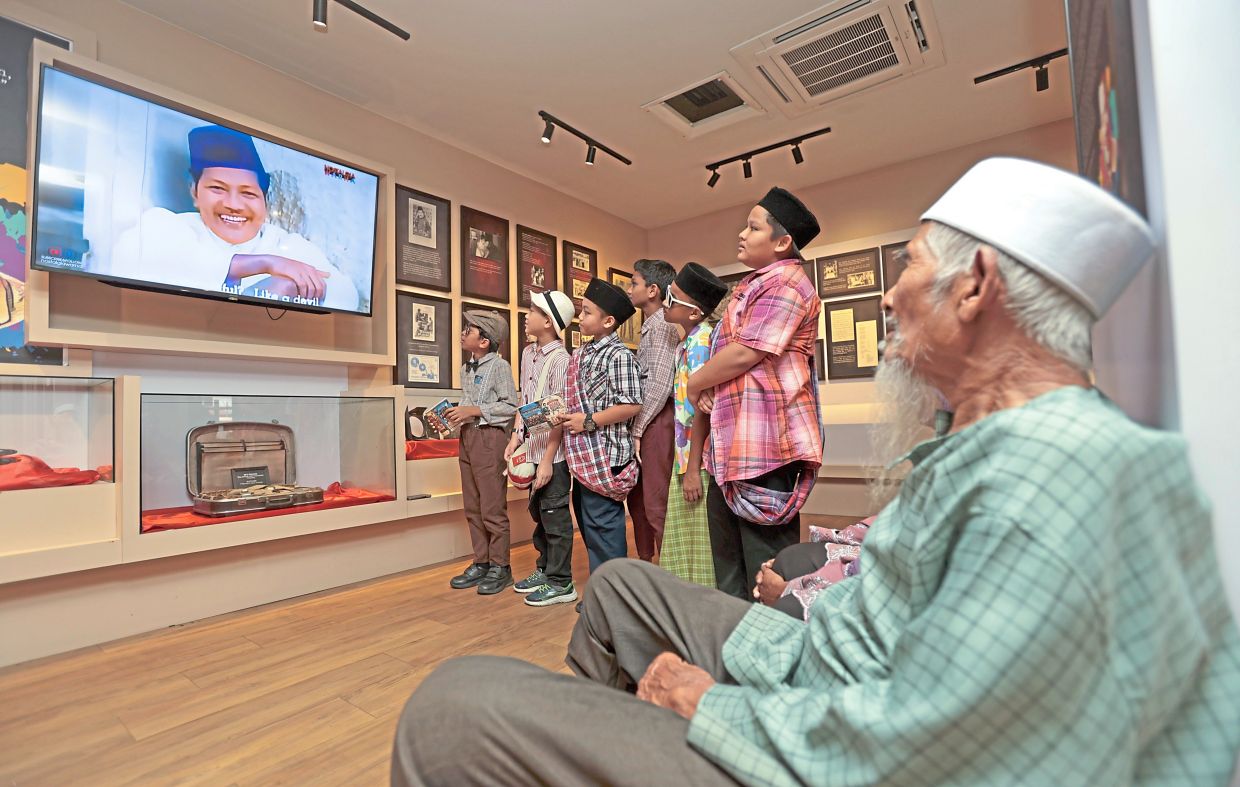 3. Visitors watching clips from P. Ramlee films at his gallery. During a career spanning the late 1940s until his death from a heart attack in 1973, the actor, singer, musician, filmmaker and composer starred in more than 80 films.