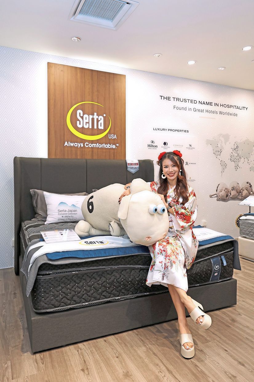 Emcee Tincy Tan testing out the Grand sirius luxury mattress.