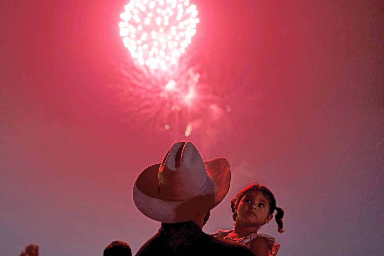 4. Fireworks lighting up the night sky during the annual Independence Day celebration in South Gate, California.