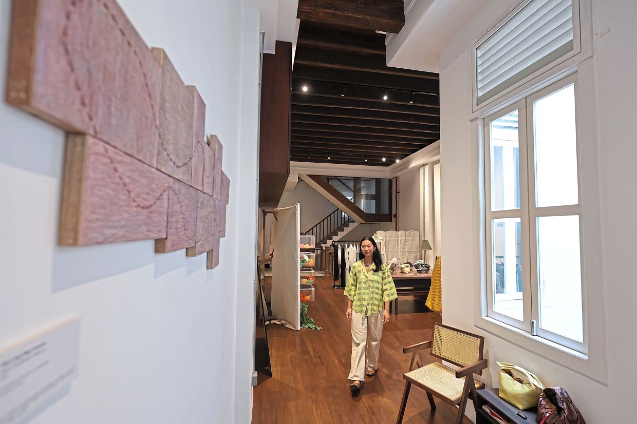 Aisha, the co-founder of The Dia Space, says that the boutique acts as a third space with community events like book clubs and journalling workshops. Photo: The Star/Kamarul Ariffin