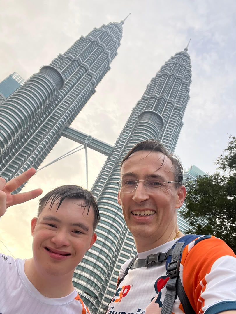 Wilhelm (right) with Alexander after completing a run near the Petronas Twin Towers in Kuala Lumpur.