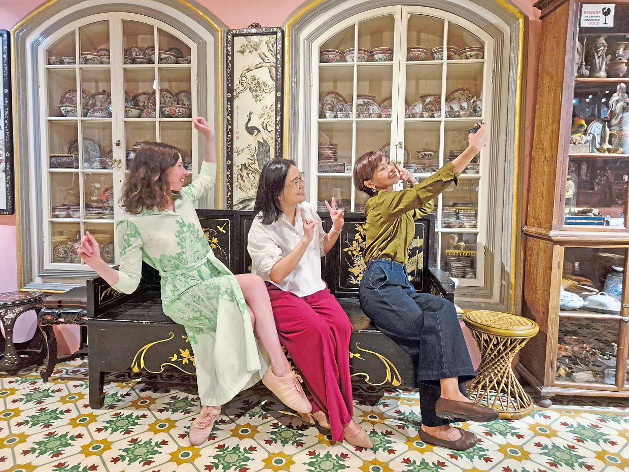 From left: Eva Houtave of Brussel's European External Action Service and Women in International Security steering committee, Nomingerel Khuyag of Mongolia’s Gerege policy think tank and Villanueva-Libunao take a selfie during their visit to the Peranakan Museum.