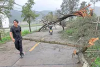 Heavy floods submerge roads and vehicles