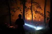 Blaze near Paris burns on as heatwave tightens across Europe